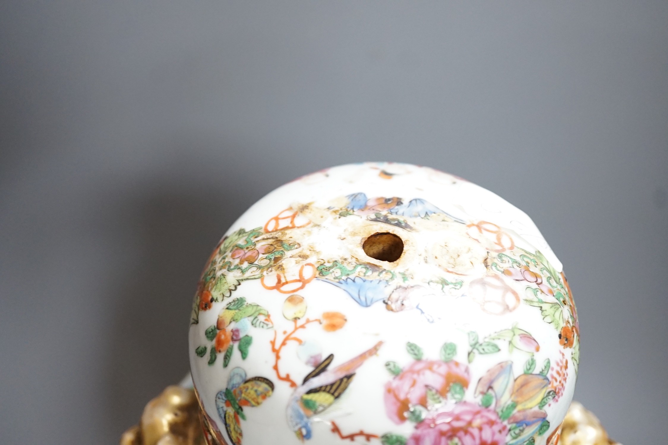 A 19th century Cantonese famille rose baluster vase and cover, the latter lacking a knop finial, 38cms high